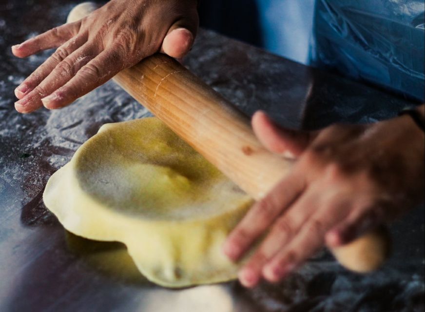 Athens: Greek Cooking Class & Dinner on a Rooftop - A chef who teaches while keeping the room at ease