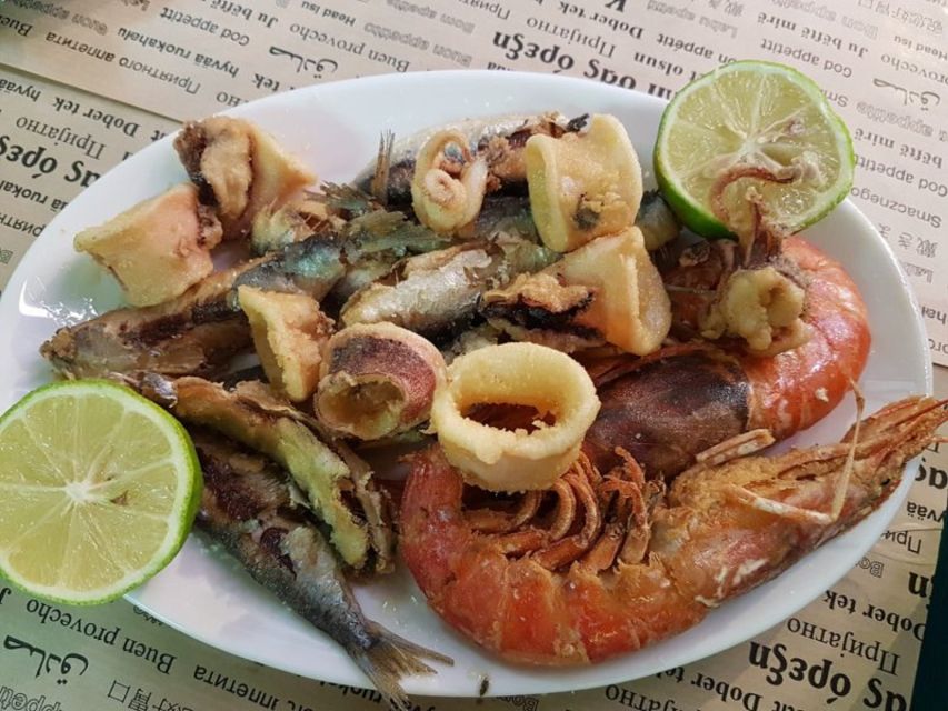 Athens: Guided Tour of 10+ Tastings of Authentic Greek Food - Seafood and ouzo at the market end of town