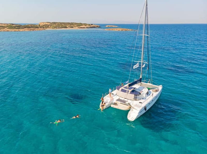 Athens: Half-Day Sunset Catamaran Cruise with Meal & Drinks - Watching the sun set from the water